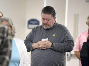 Man praying at EC Conference