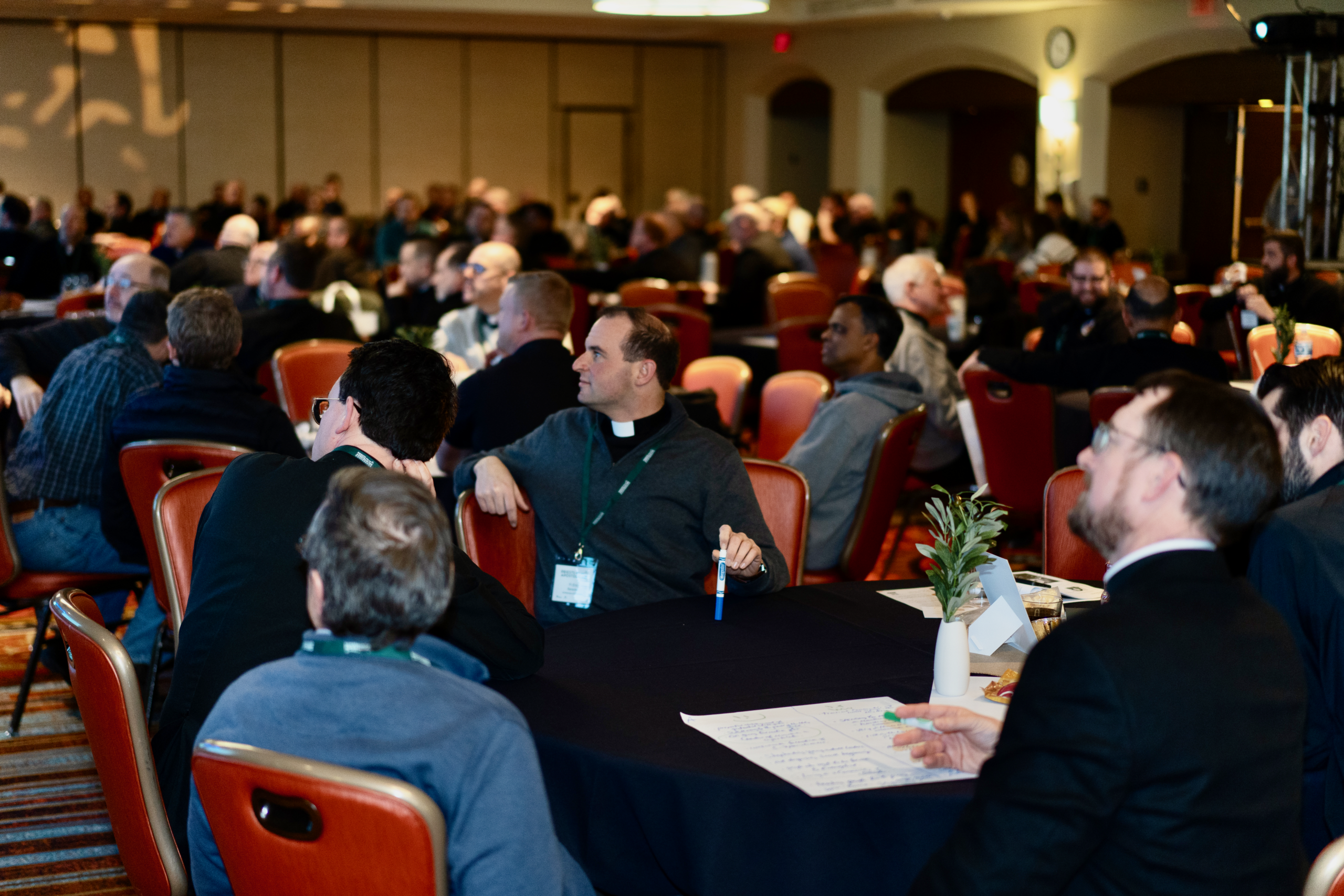 Priests in small-group discussion at the conference